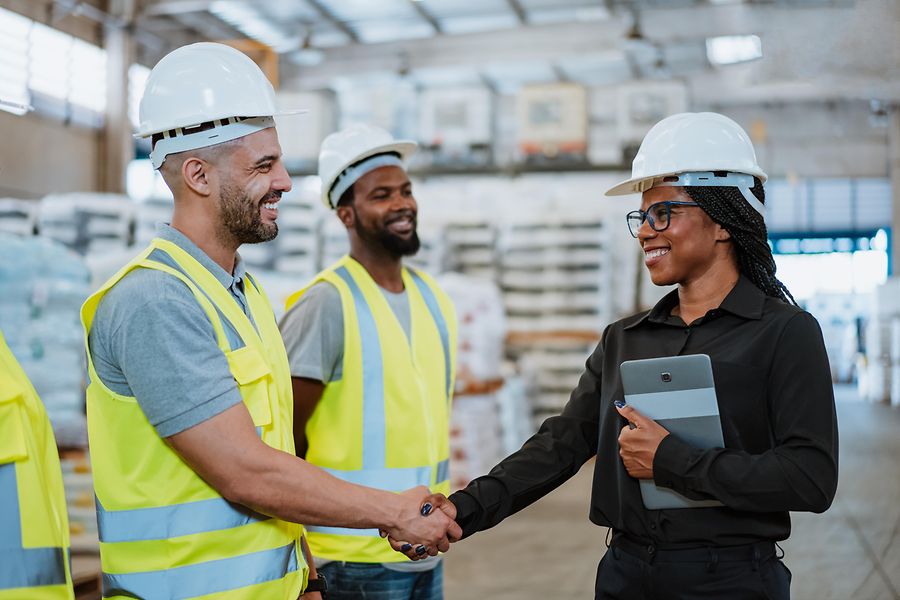 Work team in factory warehouse